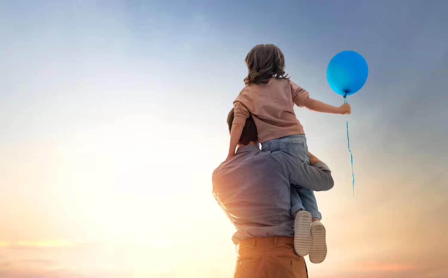 Child holding baloon